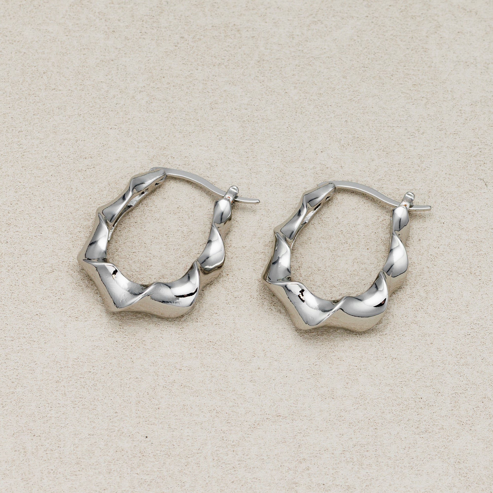 Launch Promo: 24K Gold PVD Stainless Steel Irregular Twisted Hoop Earring in Gold & Silver