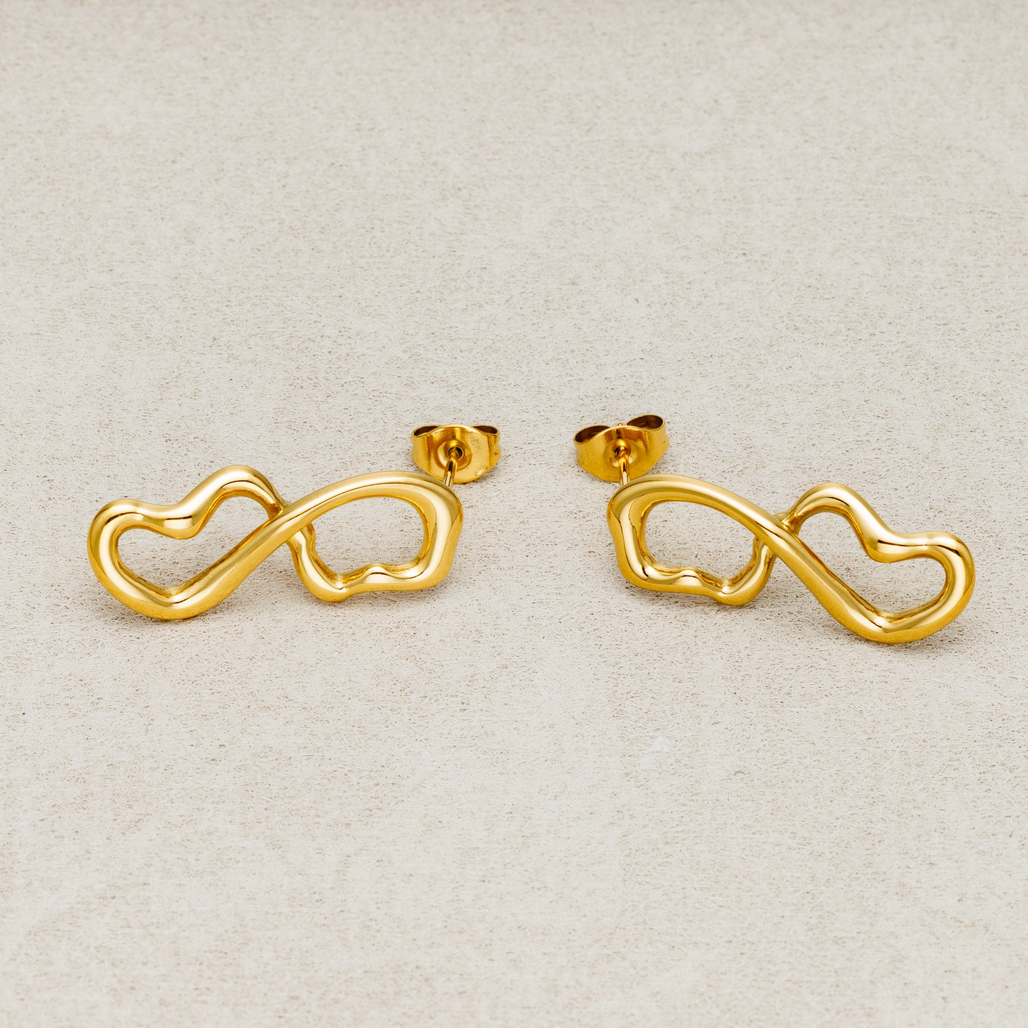 Launch Promo: 24K Gold PVD Stainless Steel Molten Infinity Love Stud Earring in Gold & Silver