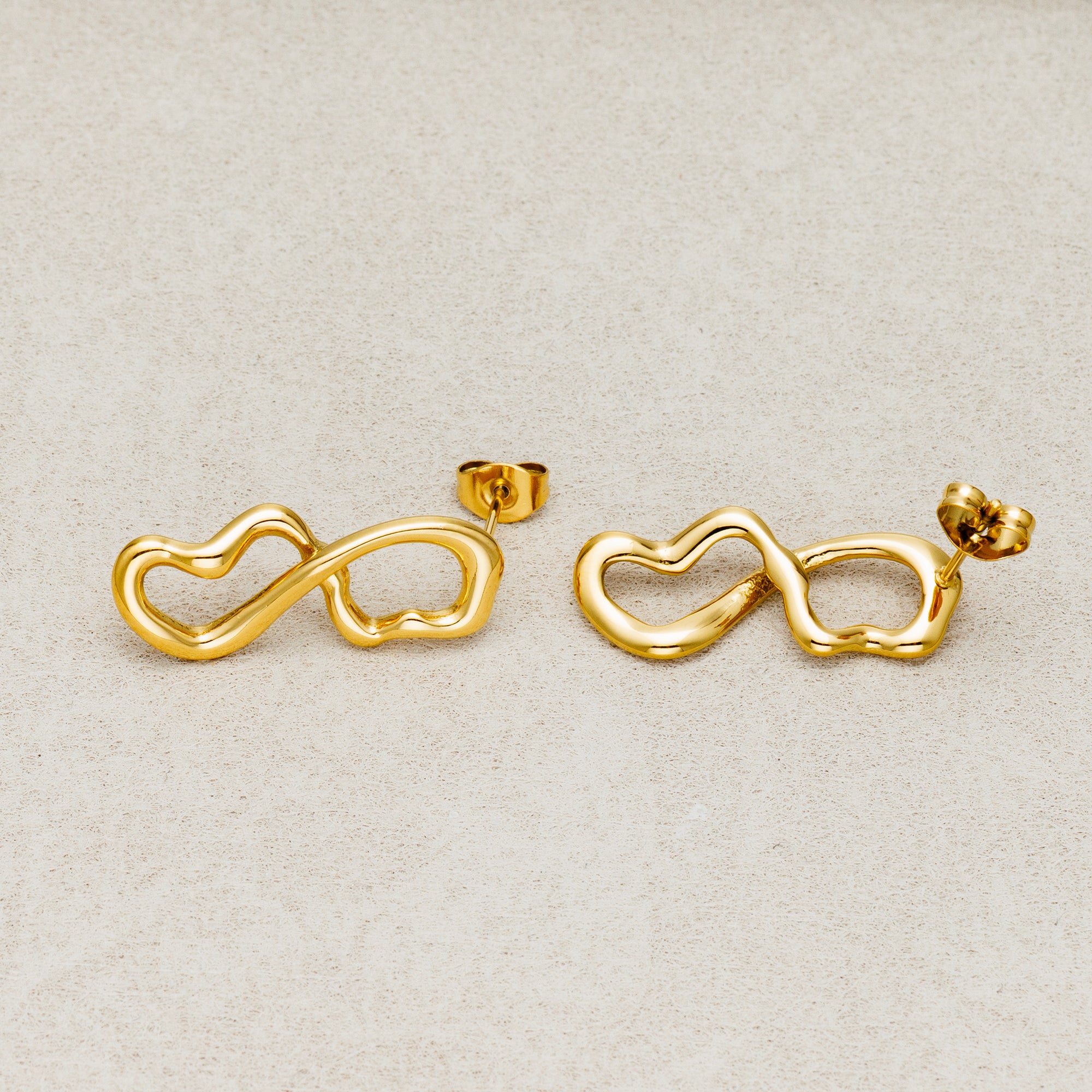 Launch Promo: 24K Gold PVD Stainless Steel Molten Infinity Love Stud Earring in Gold & Silver