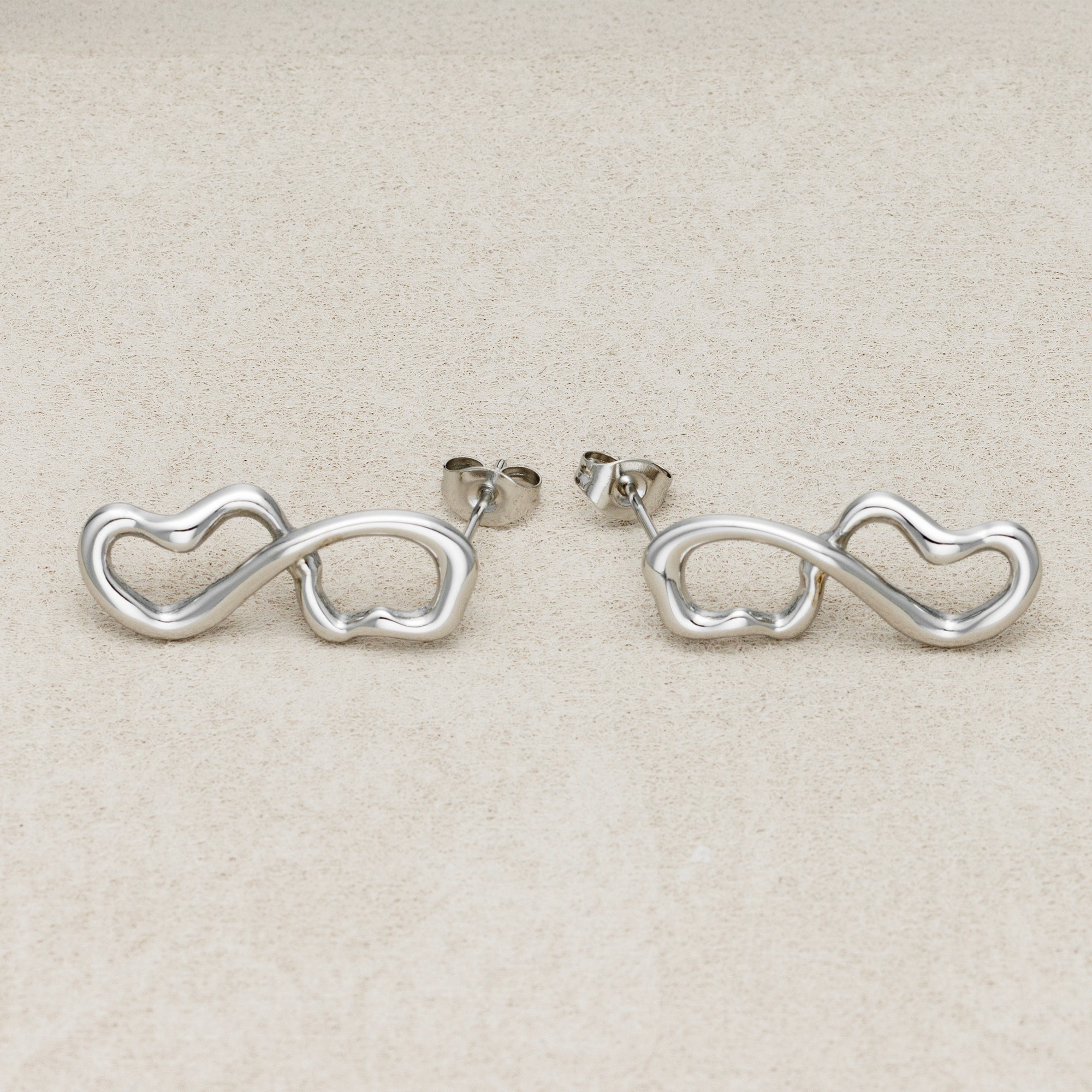 Launch Promo: 24K Gold PVD Stainless Steel Molten Infinity Love Stud Earring in Gold & Silver